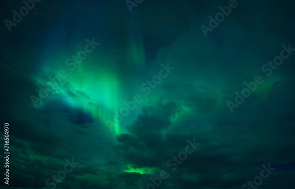 Fototapeta Northern lights between the Clouds, Aurora Borealis
