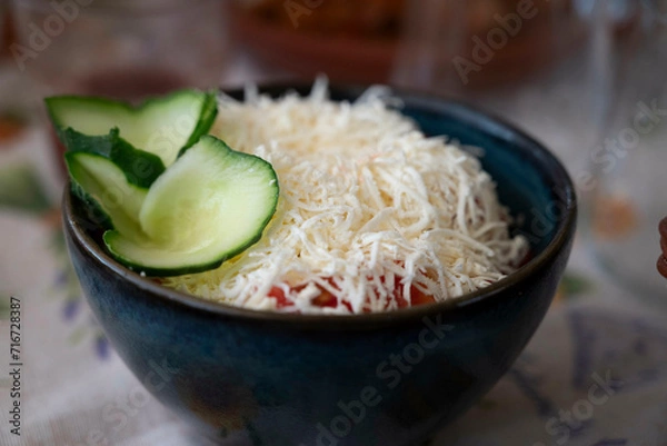 Fototapeta Shopska salad, a cold salad popular throughout Southeastern Europe. This is Bulgaria's most famous salad and national dish, whose colors recall the Bulgarian flag