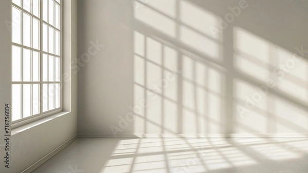 Fototapeta an empty room with the sun beaming in through the window.