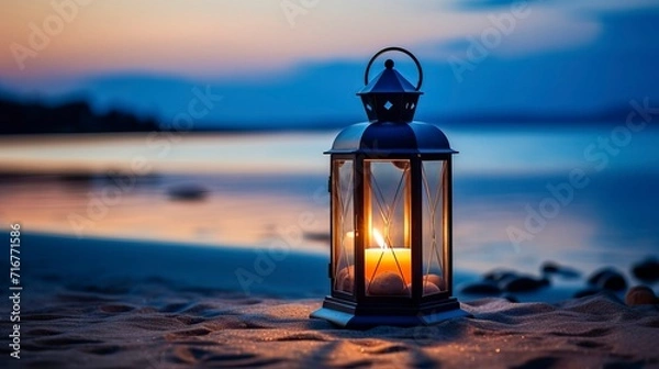 Fototapeta Candle Lantern on a Tranquil Beach at Dusk