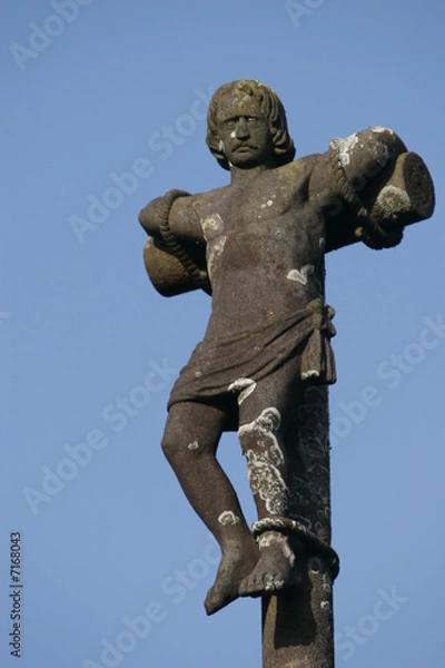 Fototapeta religious cross in a blue sky