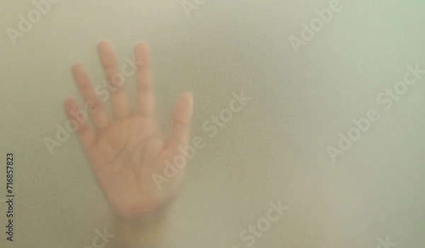 Obraz Silhouette hands behind the mirror Abstract style, One hand on a glass partition with blurry. Illustration of designer