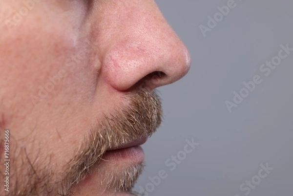 Fototapeta Closeup view of man with normal skin on grey background, space for text