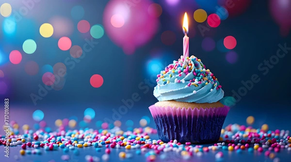 Obraz Cupcake With Lit Candle Surrounded by Sprinkles