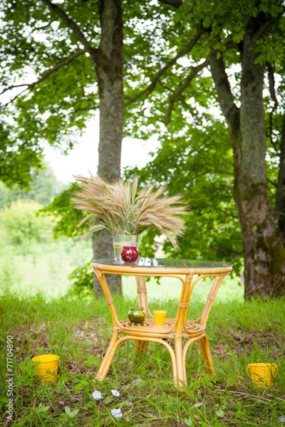 Obraz container with  green sprouts on table