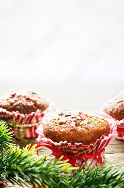 Fototapeta muffins with cinnamon and colorful topping