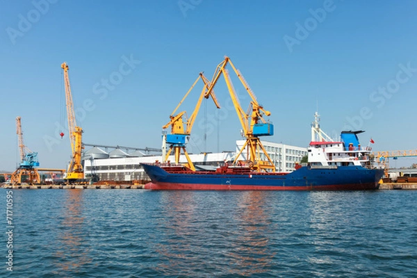 Fototapeta Industrial cargo ship is loading in Burgas port
