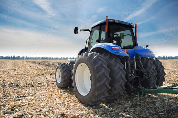Fototapeta Tractor on field