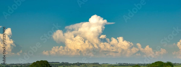 Fototapeta Beautiful white clouds on the horizon, summer Cumulonimbus clouds