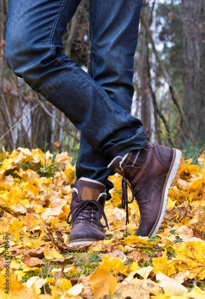 Obraz Man's legs wearing jeans and boots