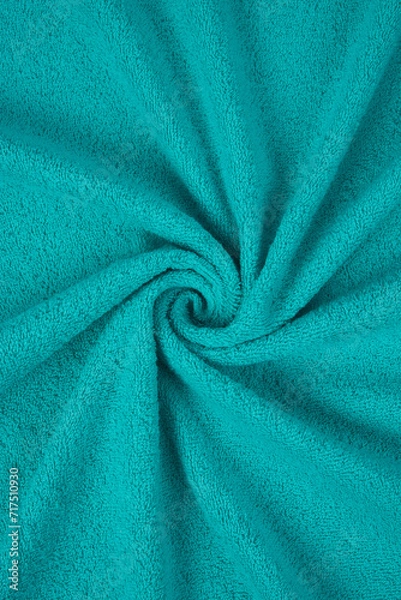 Fototapeta fragment of a green towel. The color is bright brilliant green. rolled texture.​
