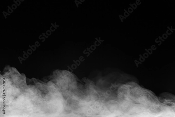 Fototapeta Blur white water vapour on isolated black background. Abstract of steam with copy space.  Smoke on black background. Steam flow.
