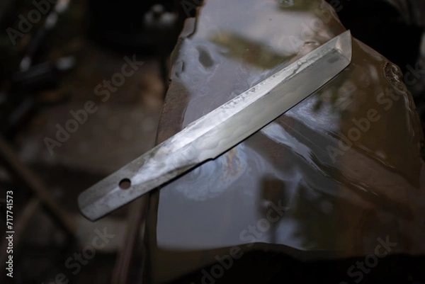 Fototapeta tanto balde hand rub with whetstone