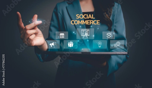 Fototapeta Businesswoman using tablet with social commerce icon and sales increase business technology on virtual screen, E-commerce and social media marketing, community, platform, Social commerce concept.