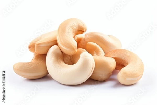 Fototapeta cashews. a bunch of peeled nuts on a white background. a healthy vegan product.