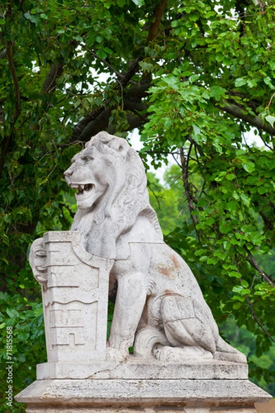 Fototapeta Stone lion with a board  in Budapest