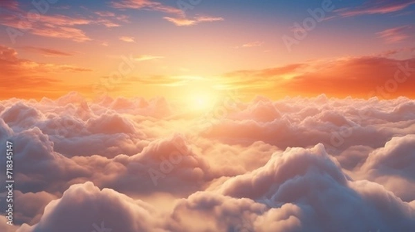Fototapeta  the sun is setting over the clouds in the sky as seen from the top of a plane in the sky.