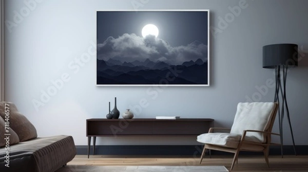 Fototapeta  a living room with a couch, chair and a painting on the wall of a night sky with a full moon.