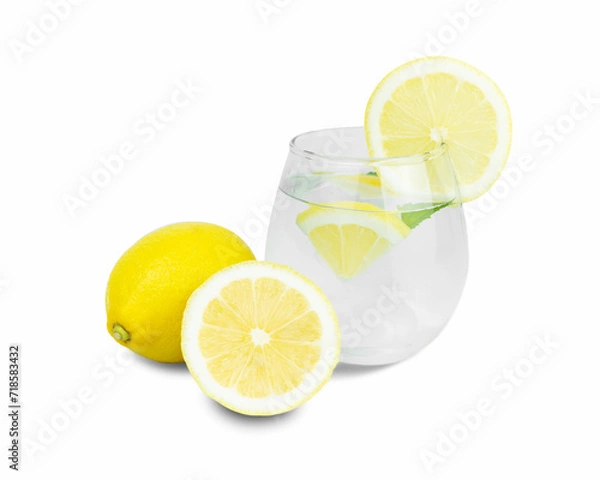 Fototapeta Infused water with some lemon slices on white background