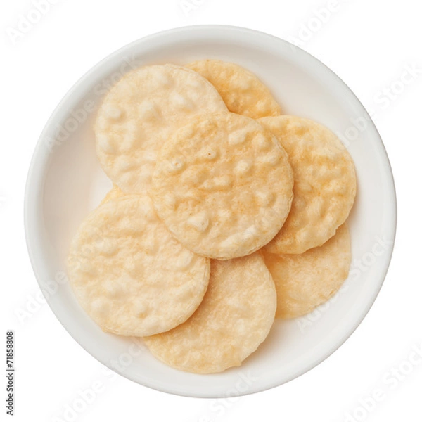 Fototapeta Rice crackers in a bowl isolated on white background