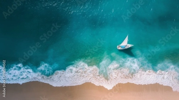 Fototapeta Top down view of tropical beach waves engulfing the sand