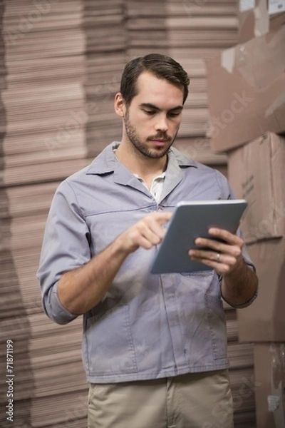 Fototapeta Warehouse worker using digital tablet