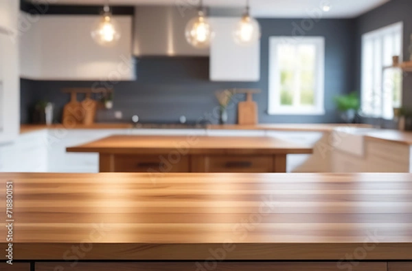 Fototapeta Empty beautiful wood table top counter and blur modern kitchen interior background in clean and bright, Banner, Ready for product montage