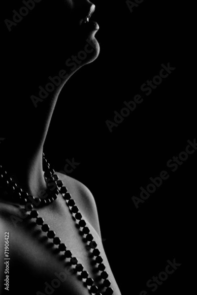 Obraz Woman's pearl passion isolated black bacground