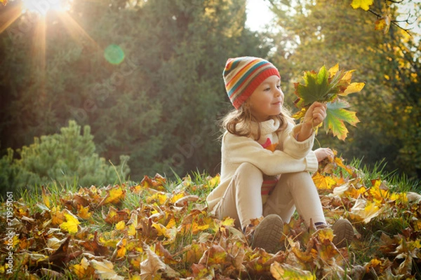 Obraz Cute child playing with autumn leaves