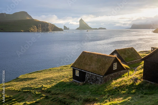 Fototapeta Houses with turf roofs, Bour village, vagar island, faroe islands, denmark, europe
Sunny summer view of Saksun village with typical turf-top houses.
Traveling concept background.