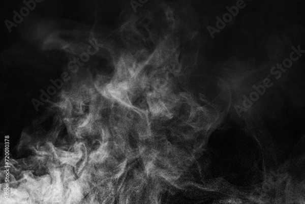 Fototapeta Blur white water vapour on isolated black background. Abstract of steam with copy space.  Smoke on black background. Steam flow.