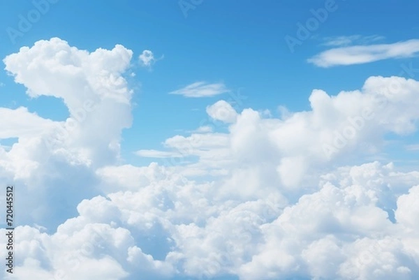 Fototapeta Cumulus clouds in a blue sky, copy space