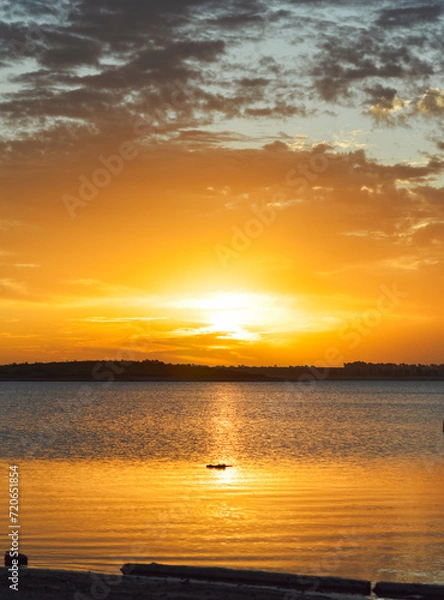 Obraz Golden hour on lake with beautiful cloud silhouettes