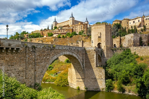 Obraz Cityscape of Toledo with the Alcantara bridge in the forefront, Toledo, Spain