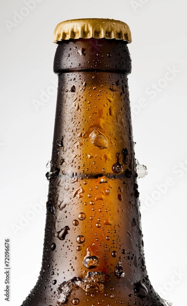 Obraz Bottle of ice cold beer with ice and drops