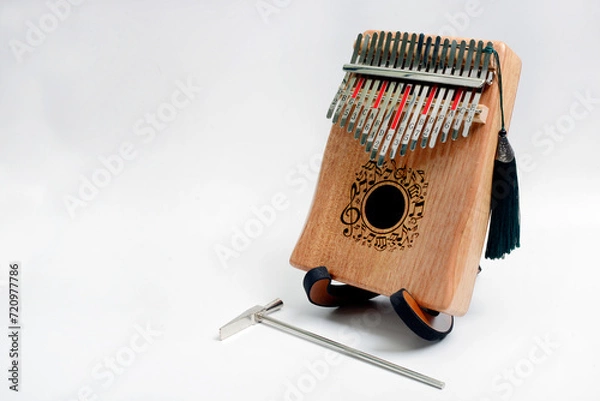 Fototapeta Kalimba is a percussion musical instrument. It is a modern version of the mbira musical instrument from southern Africa. Another name is the thumb piano from Africa, photos from several views