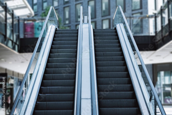 Obraz The escalator with modern buildings in modern office building.
