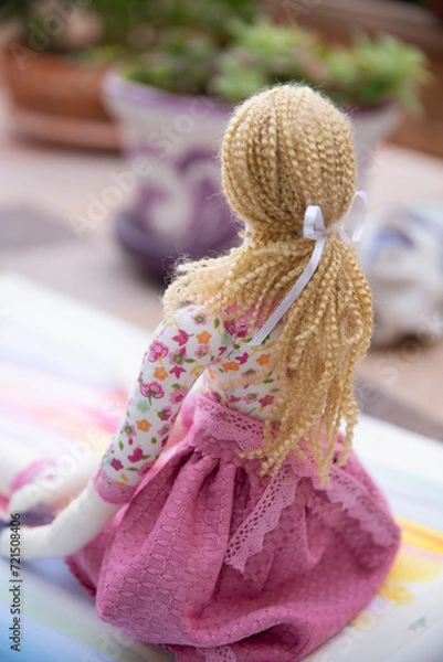 Fototapeta toddler doll on the colorful background, vintage style, selective focus