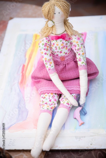 Fototapeta toddler doll on the colorful background, vintage style, selective focus