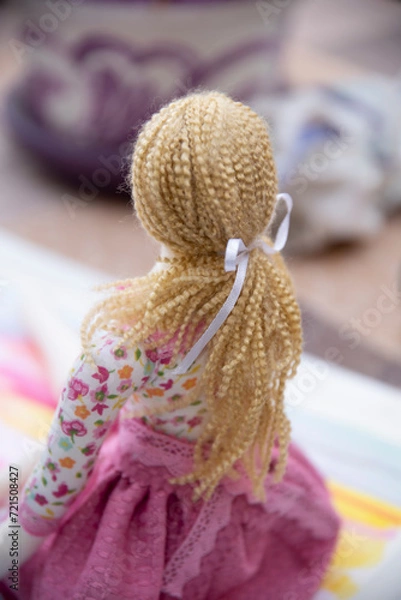 Fototapeta toddler doll on the colorful background, vintage style, selective focus