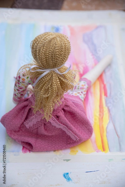 Fototapeta toddler doll on the colorful background, vintage style, selective focus