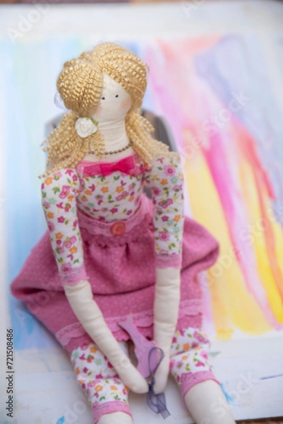 Fototapeta toddler doll on the colorful background, vintage style, selective focus