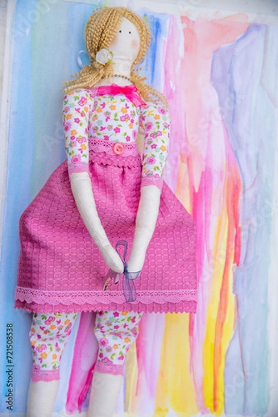 Fototapeta toddler doll on the colorful background, vintage style, selective focus