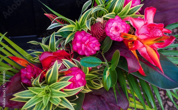 Fototapeta A vivid bouquet of tropical flowers is ready for sale at a Farmers Market on Kauai.