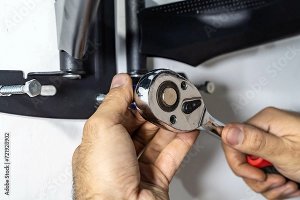 Obraz man installing TV base at home