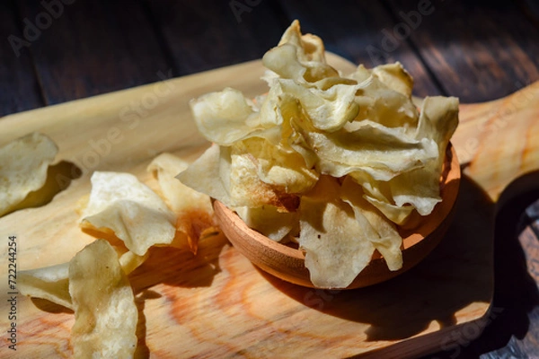 Fototapeta Keripik talas or taro chips is made of deep fried thin slice taro . Crispy savory snack. Typical Indonesian traditional chips.