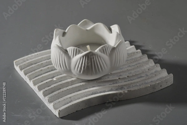 Obraz Candle holder on gray background. Ceramic candlestick.