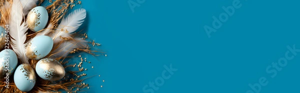 Fototapeta Banner gold and blue Easter eggs decorated with feathers and sparkles on a blue background