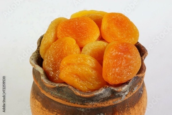 Fototapeta Dried apricot fruits without seeds. It is used in cooking when making desserts.