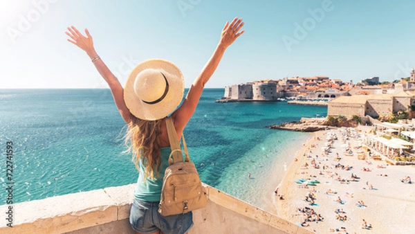 Fototapeta Happy woman tourist enjoying view of the old town of Dubrovnik in Croatia